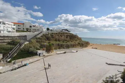 a view of a beach with buildings and the ocean at Edifício Albufeira 406 in Albufeira