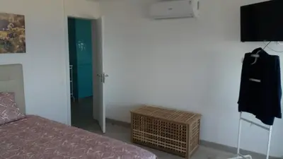 a bedroom with a bed and a television on a wall at Edifício Albufeira 406 in Albufeira