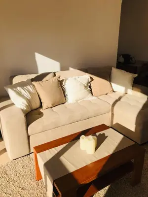 a living room with a couch and a coffee table at sol nascente in Vilamoura