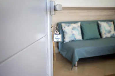 a door with a room with a couch and a tag at Villa Lydia in Faro