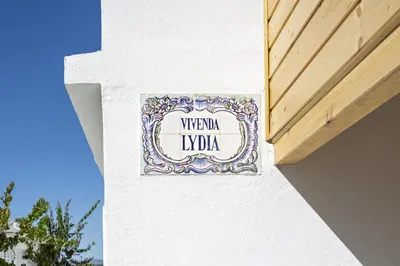 a sign on the side of a building at Villa Lydia in Faro