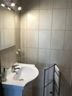 a bathroom with a white sink and a mirror at BREEZY NEST by ITHOUSE in Albufeira