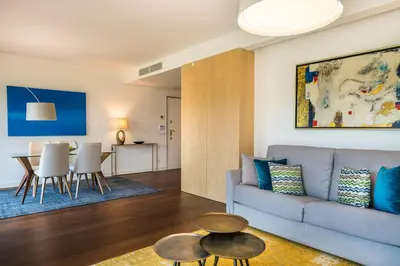 a living room with a couch and a table at Vilamoura Charming Apartment by Intiholidays in Vilamoura