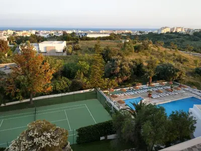 an aerial view of a tennis court in a villa at Panoramic Sea View 1 Bedroom Apartment in Albufeira