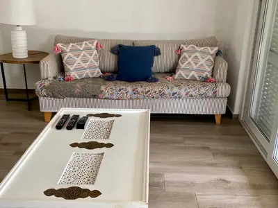 a coffee table in a living room with a couch at Villa Zen - beautiful private pool-heating option, hot tub, beautiful garden in Albufeira