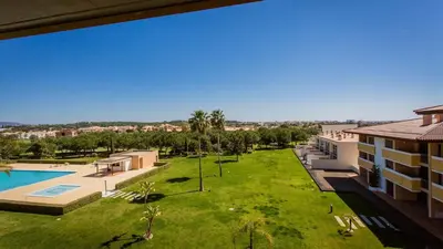 an aerial view of the courtyard of a apartment building with a yard at Monte Laguna Duplex - Greice Homes in Vilamoura
