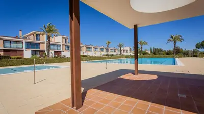 a view of a swimming pool and a building at Monte Laguna Duplex - Greice Homes in Vilamoura
