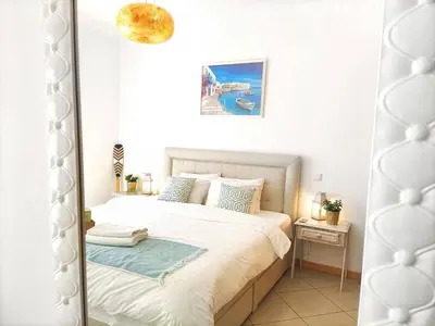 a mirror reflection of a bed in a bedroom at AlbufeiraOrada by Be Cherish in Albufeira