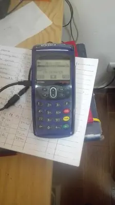 a cell phone sitting on top of papers on a desk at Residencial Condado in Faro