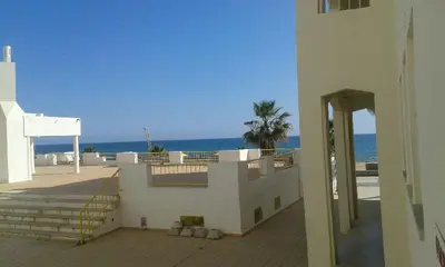 a white building with a view of the ocean at Atlântida T1 in Cavacos