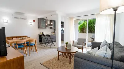 a living room with a couch and a table at Vale do Lobo - Casa de La Rosa in Vale do Lobo