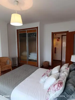 a bedroom with a large bed with pillows on it at Balcony View Albufeira in Albufeira
