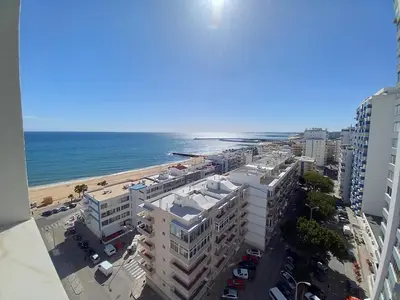 an aerial view of the beach and buildings at Torre Azul 11 Vista Panoramica in Quarteira