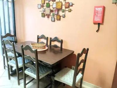 a dining room with a table and chairs at cosy2bedroomapartment in Loulé