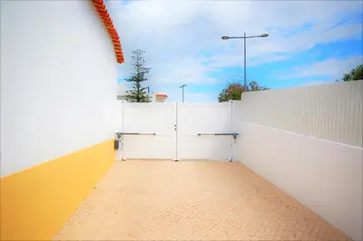 a white fence with a gate on the side at Vila Baltum - Free private parking - Wifi - Airco # by bedzy # in Albufeira