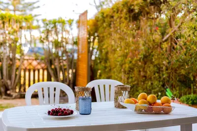 a white table with a bowl of fruit on it at Villa V1 Vale do Lobo Beach in Vale do Lobo