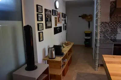 a room with a table and a tv on a wall at FIND Your Space Casa no Campo - Paderne - Albufeira - Piscina Privada - Aquecida a pedido in Paderne