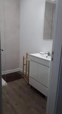 a white bathroom with a sink and a mirror at Hello Chloé in Vilamoura