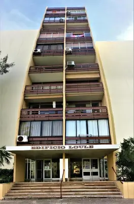 a tall building with stairs in front of it at Hello Chloé in Vilamoura