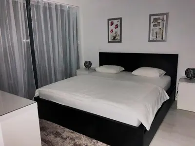 a bedroom with a large bed with white sheets at Cavalo Preto Luxury Beach Resort - C201 in Quarteira