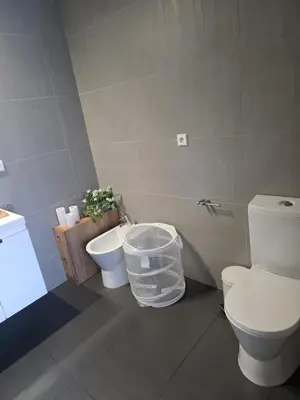 a bathroom with a white toilet and a bidet at Cavalo Preto Luxury Beach Resort - C201 in Quarteira