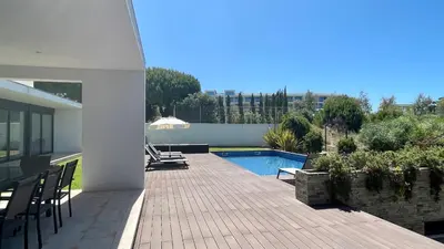 a patio of a house with a swimming pool at Passion by Check-in Portugal in Albufeira