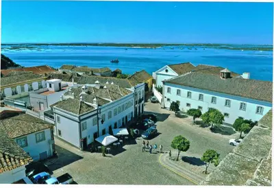 an aerial view of a town with the ocean at Hotel Adelaide in Faro