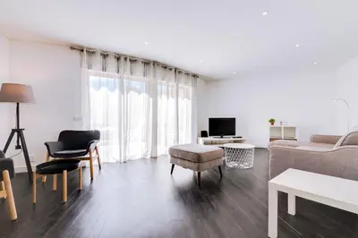 a white living room with a couch and chairs at AL - Apartamento Terracos da Falesia in Vilamoura