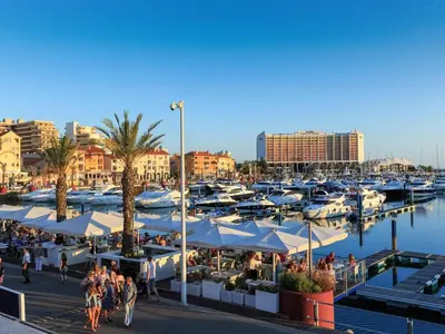 a marina with a bunch of boats in the water at Amendoeiras I - Central Vilamoura in Vilamoura