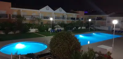 an image of a swimming pool at night at Apartamento T2 Encosta sao jose in Albufeira