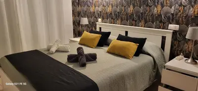 a bedroom with a bed with two stuffed animals on it at Apartamento T2 Encosta sao jose in Albufeira