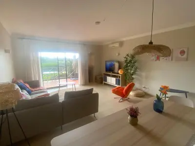 a living room with a couch and a table at Corcovada 37 in Albufeira