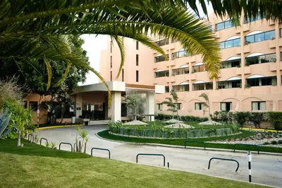 a large swimming pool in front of a building at Vila Gale Atlantico in Albufeira
