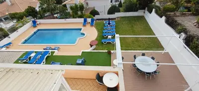 an overhead view of a swimming pool with lounge chairs at Villa Ramos in Albufeira