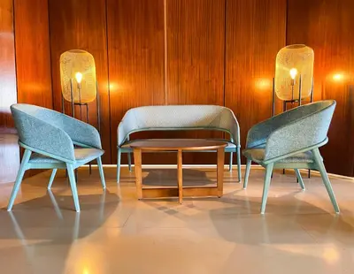 three chairs and a table in a room at Auramar Beach Resort in Albufeira