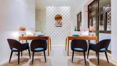 a dining room with two tables and chairs at Hotel Sol e Mar Albufeira - Adults Only in Albufeira