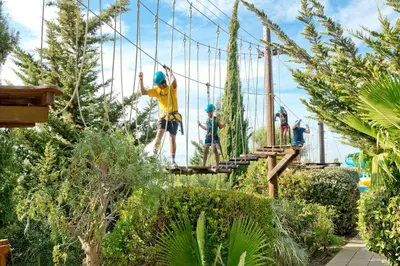 a group of people on a suspension bridge at Alfagar Alto da Colina in Albufeira