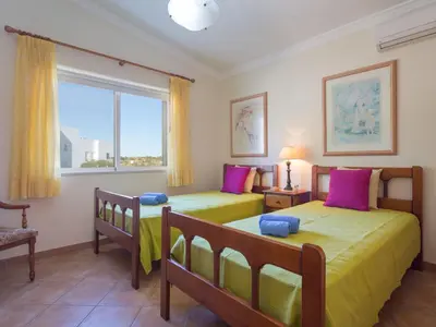a bedroom with two beds and a window at Villa Villa Natura by Interhome in Guia