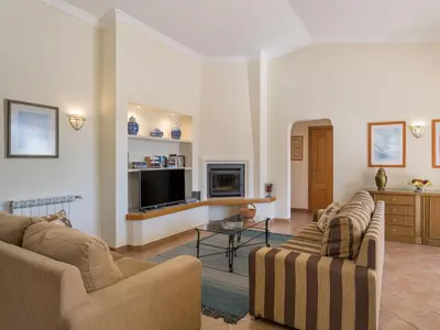 a living room with two couches and a tv at Villa Villa Natura by Interhome in Guia