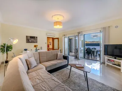 a living room with a couch and a tv at Villa Colibri by Interhome in Patroves