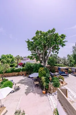a window with a towel sitting on a table looking out at Casa do Alto in Vilamoura