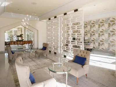 a living room with a couch and a table at Ria Park Hotel & Spa in Vale do Lobo