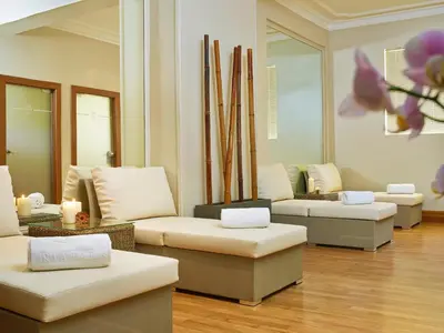 a living room with couches and chairs in a room at Ria Park Hotel & Spa in Vale do Lobo