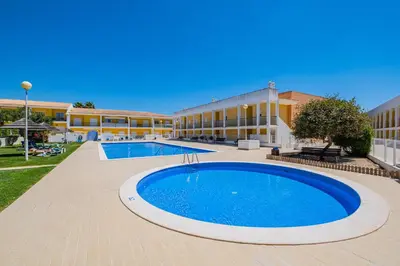 a large swimming pool in front of a building at Pool&Beach in Encosta de São José in Albufeira