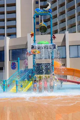 a group of children playing in a water park at Jupiter Albufeira Hotel - Family & Fun - All Inclusive in Albufeira