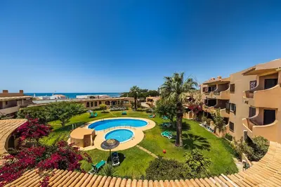 an aerial view of a resort with a swimming pool at Clube Maria Luisa in Albufeira