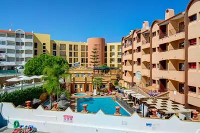 an aerial view of a resort with a swimming pool and buildings at Choromar Apartments in Albufeira