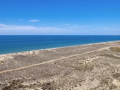 an aerial view of a beach with the ocean at Vale Do Garrao Villas in Vale do Lobo