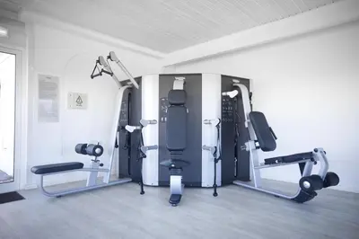 a gym with several tread machines in a room at Cegonha Country Club in Vilamoura