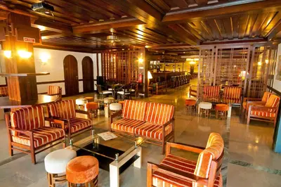 a lobby with couches and chairs and a table at Apartamentos da Balaia in Albufeira